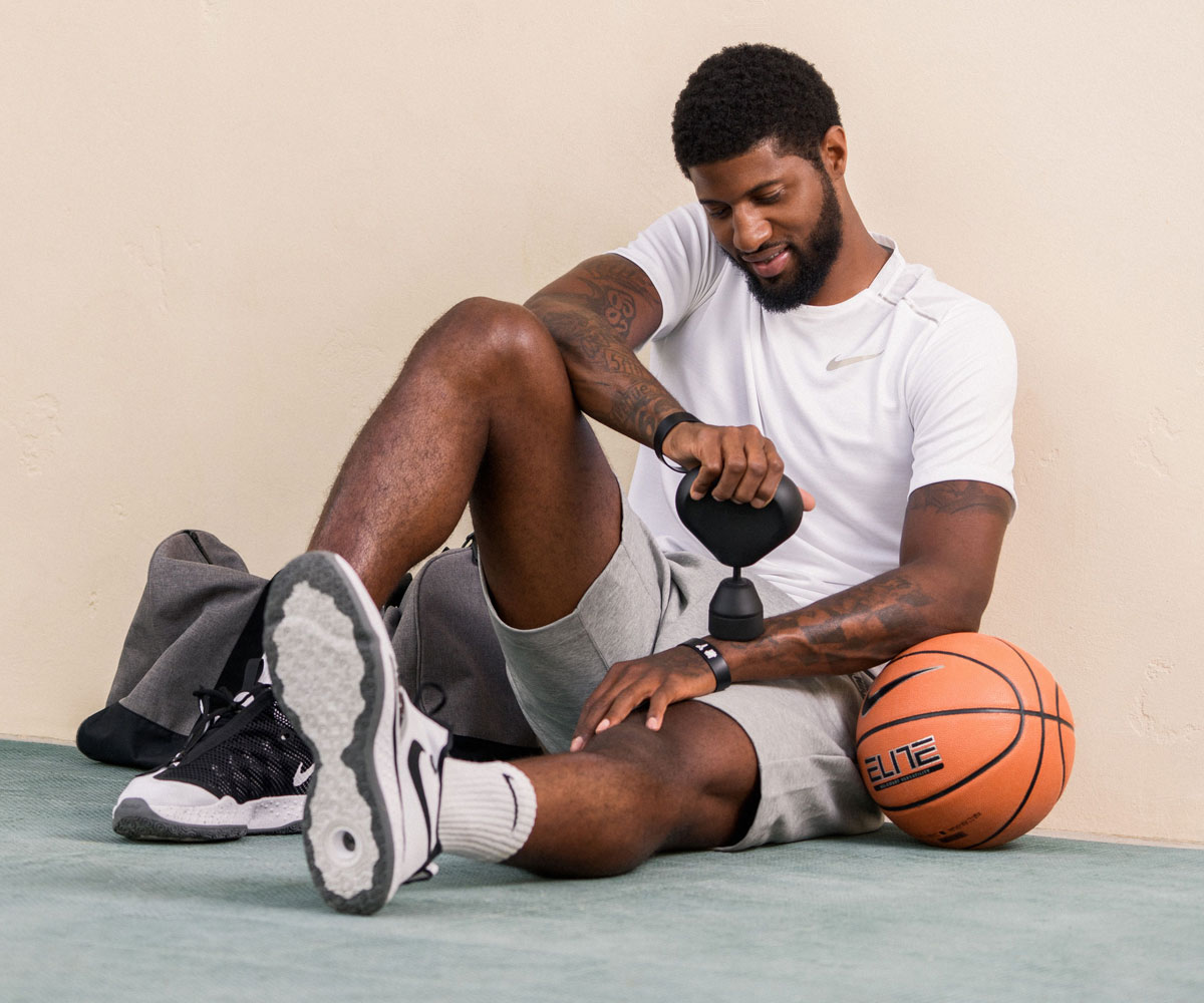 Theragun hand massager used for sports injury